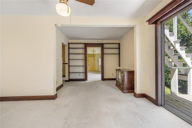 625 W College Ave, Harrison, AR 72601 - unfurnished room with light carpet, stairs, and ceiling fan