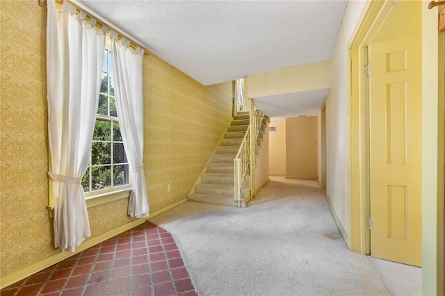 625 W College Ave, Harrison, AR 72601 - entrance foyer featuring stairs, wallpapered walls, and a textured ceiling