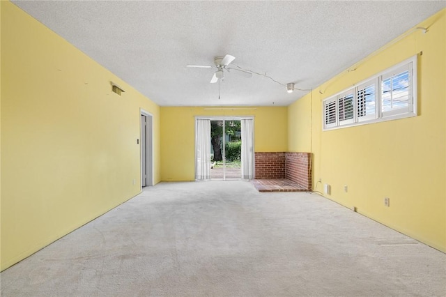 625 W College Ave, Harrison, AR 72601 - unfurnished room featuring a textured ceiling, carpet, and ceiling fan