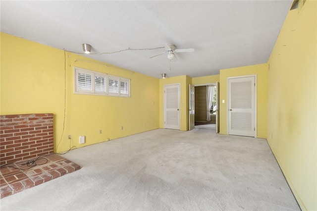 625 W College Ave, Harrison, AR 72601 - unfurnished living room featuring carpet, a ceiling fan, and plenty of natural light