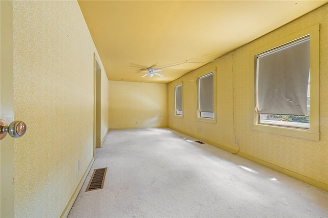 625 W College Ave, Harrison, AR 72601 - carpeted spare room featuring a ceiling fan and healthy amount of natural light