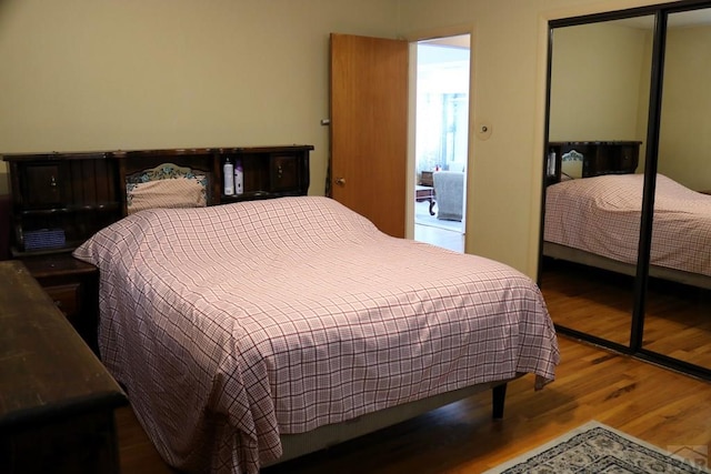 bedroom with a closet and wood finished floors