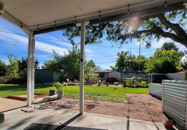 view of patio / terrace featuring fence