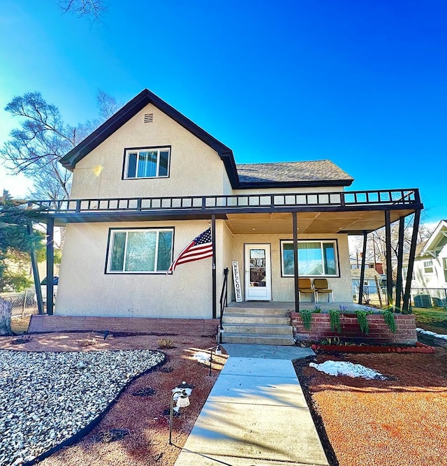 view of front of property with covered porch and stucco siding