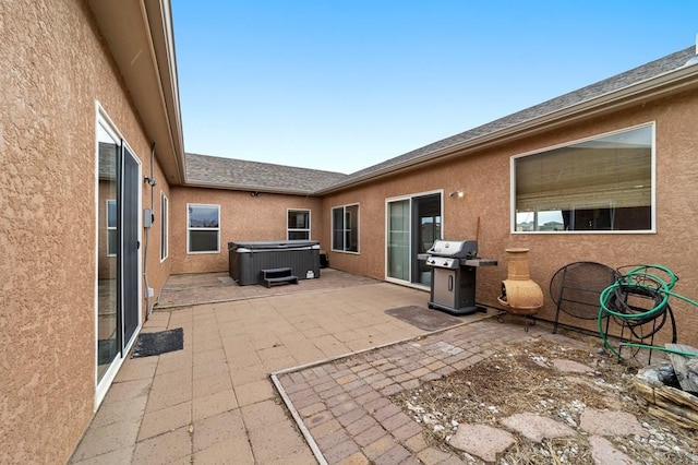 1037 W Desert Sage Dr, Pueblo West, CO 81007 - view of patio featuring a hot tub and a grill