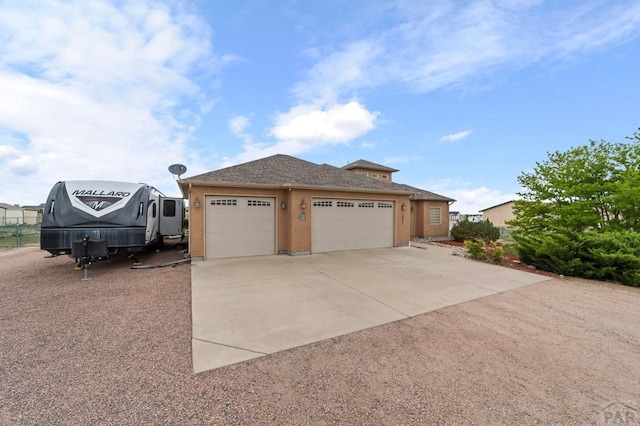 1037 W Desert Sage Dr, Pueblo West, CO 81007 - view of front of home with concrete driveway and a garage
