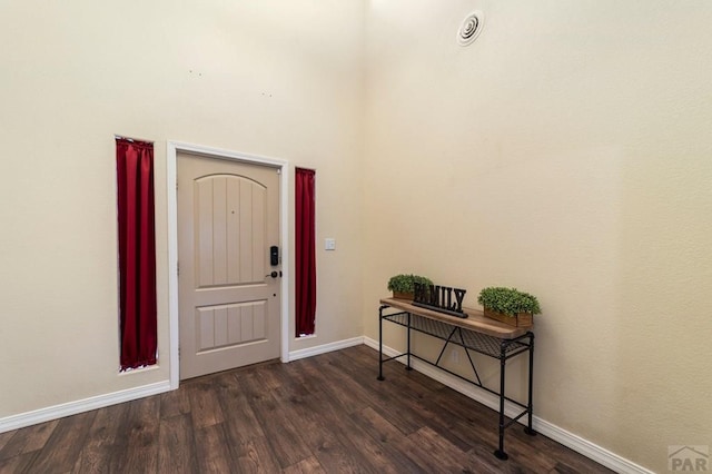 1037 W Desert Sage Dr, Pueblo West, CO 81007 - foyer entrance with dark wood-style flooring and baseboards
