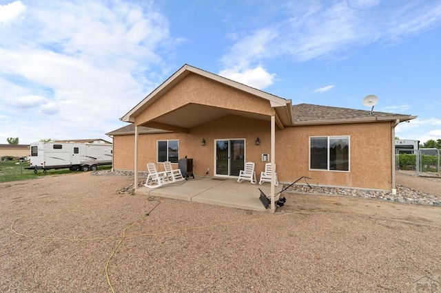 1037 W Desert Sage Dr, Pueblo West, CO 81007 - back of property featuring a patio area and stucco siding
