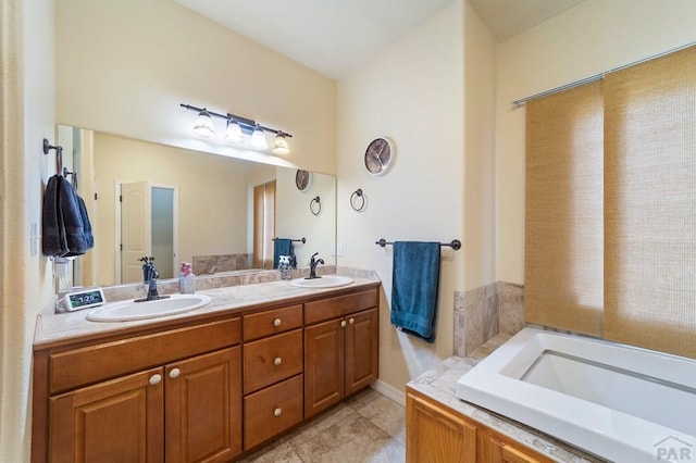 1037 W Desert Sage Dr, Pueblo West, CO 81007 - full bathroom with double vanity, a garden tub, and tile patterned floors