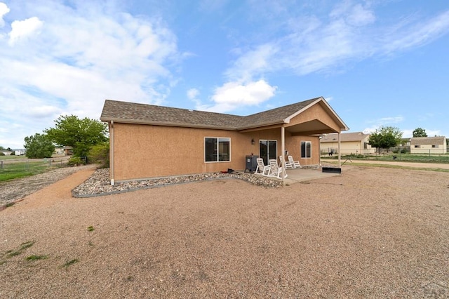 1037 W Desert Sage Dr, Pueblo West, CO 81007 - back of house featuring a patio and stucco siding