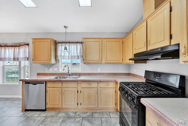 kitchen featuring under cabinet range hood, a sink, light countertops, dishwasher, and black gas range oven