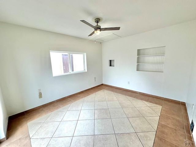 unfurnished room featuring light tile patterned floors and ceiling fan