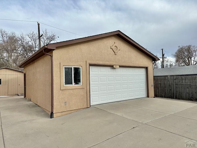 detached garage with fence