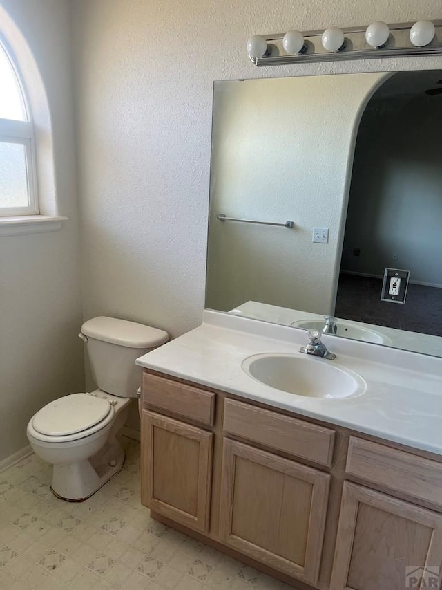 4706 Solar Dr, Pueblo, CO 81005 - bathroom featuring toilet, tile patterned floors, and vanity