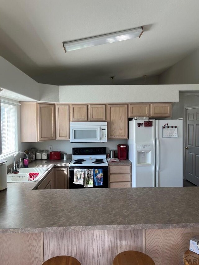 4706 Solar Dr, Pueblo, CO 81005 - kitchen with a sink and white appliances