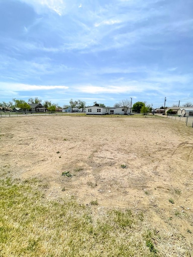 view of yard with a rural view