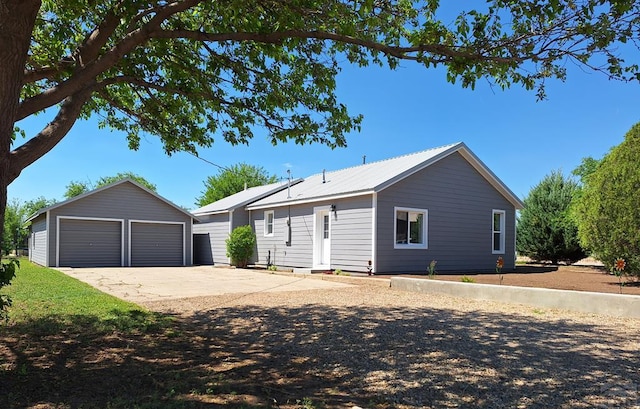 211 W Maplewood, Walsh, CO 81090 - ranch-style home featuring an outdoor structure and a garage