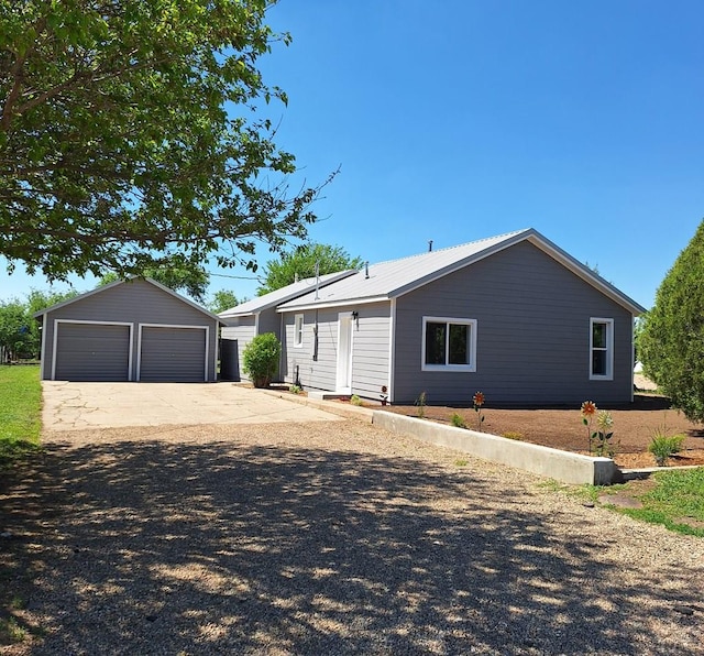 211 W Maplewood, Walsh, CO 81090 - ranch-style house featuring an outbuilding and a detached garage