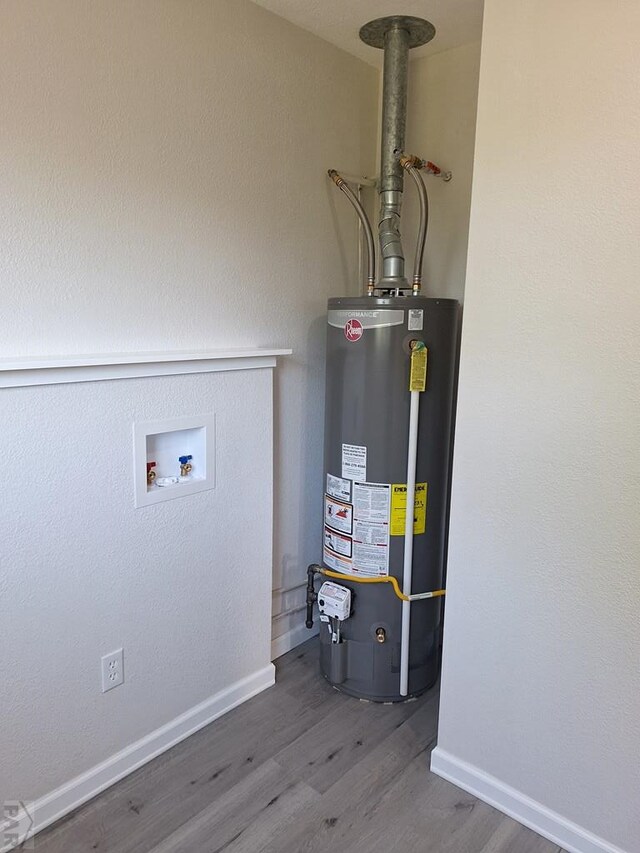 211 W Maplewood, Walsh, CO 81090 - utility room with gas water heater