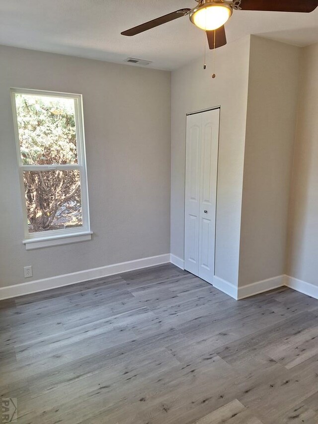 211 W Maplewood, Walsh, CO 81090 - unfurnished bedroom featuring wood finished floors, baseboards, ceiling fan, and a closet
