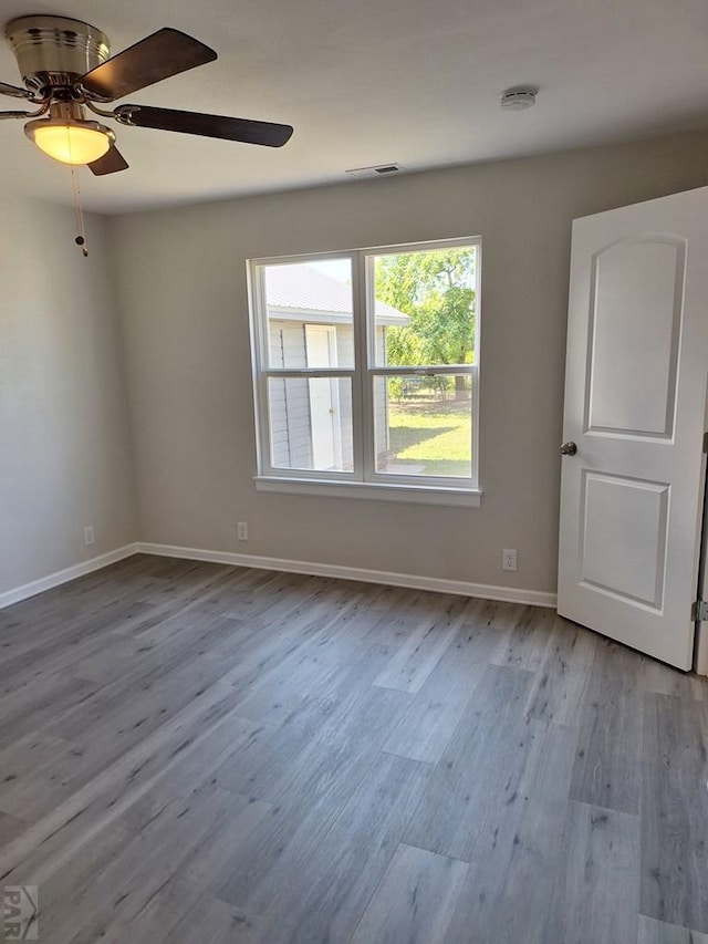 211 W Maplewood, Walsh, CO 81090 - spare room with wood finished floors, ceiling fan, and baseboards