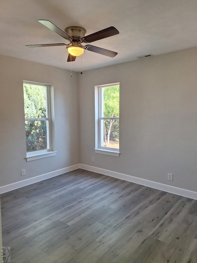 211 W Maplewood, Walsh, CO 81090 - unfurnished room with wood finished floors, baseboards, and ceiling fan