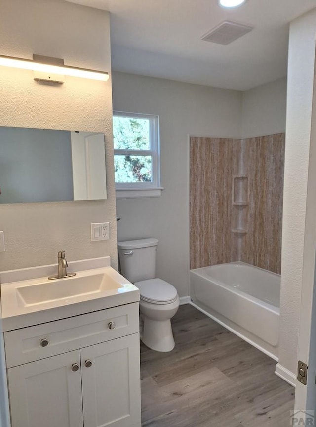 211 W Maplewood, Walsh, CO 81090 - bathroom featuring toilet, wood finished floors, vanity, and baseboards
