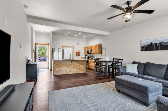 349-351 W Buttercup Way, Pueblo West, CO 81007 - living area with dark wood-style floors, ceiling fan, and recessed lighting