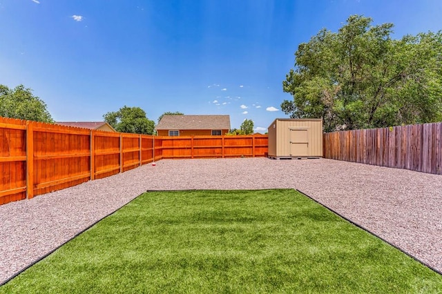 349-351 W Buttercup Way, Pueblo West, CO 81007 - fenced backyard with a storage unit and a patio area