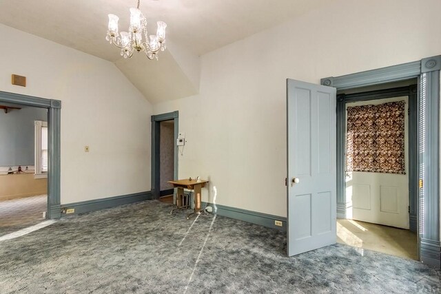 1708 Alta St, Trinidad, CO 81082 - unfurnished room featuring carpet flooring, lofted ceiling, and a chandelier