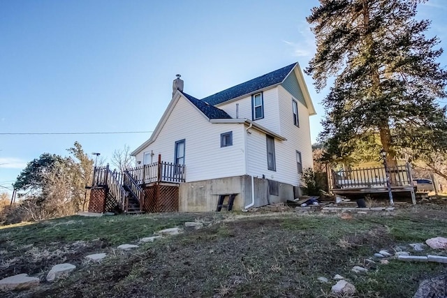 1708 Alta St, Trinidad, CO 81082 - rear view of property featuring a chimney, stairs, and a deck