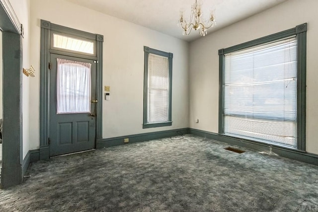 1708 Alta St, Trinidad, CO 81082 - carpeted entryway with a chandelier and baseboards