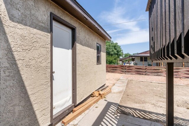 view of side of home featuring stucco siding