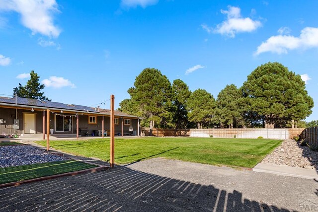 view of yard featuring a fenced backyard and a patio