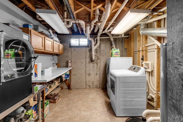 interior space featuring cabinet space and washer and dryer