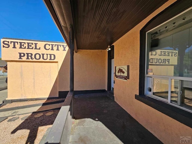 exterior space featuring stucco siding