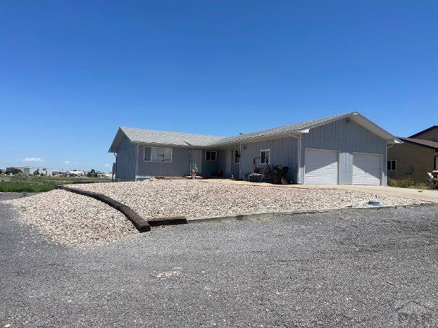 629 E Clarion Dr, Pueblo, CO 81007 - view of front of property featuring an attached garage