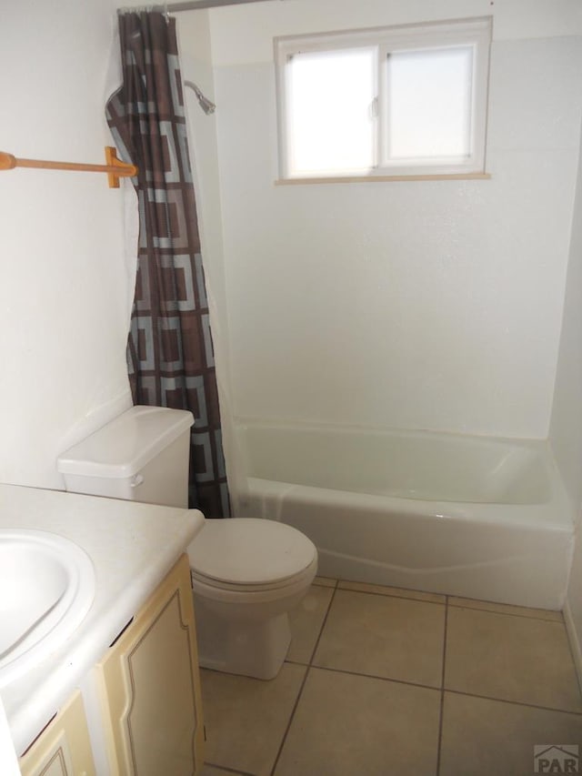 629 E Clarion Dr, Pueblo, CO 81007 - full bath with vanity, tile patterned floors, and shower / bath combo with shower curtain