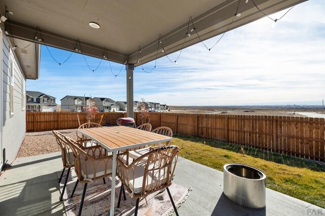 view of patio featuring outdoor dining space and a fenced backyard