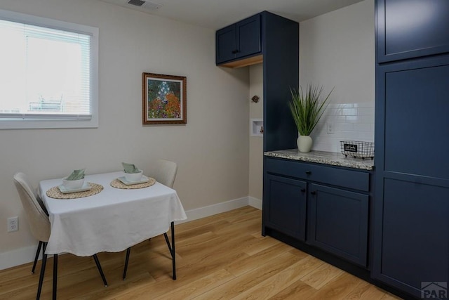 1709 Henry Ave, Pueblo, CO 81005 - dining space with light wood-style flooring and baseboards