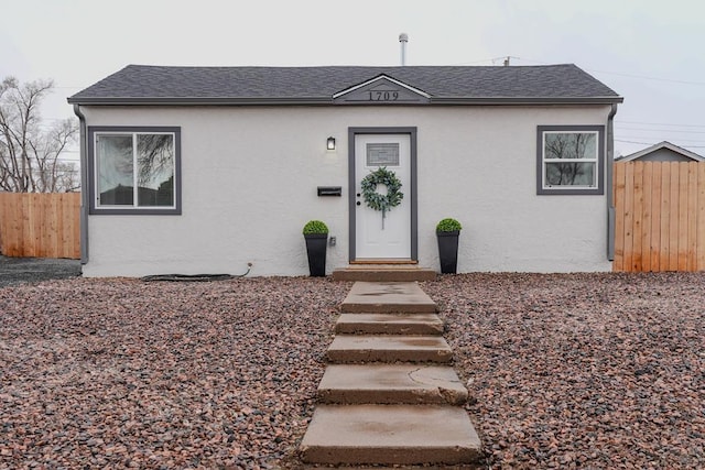 1709 Henry Ave, Pueblo, CO 81005 - view of front facade featuring stucco siding and roof with shingles
