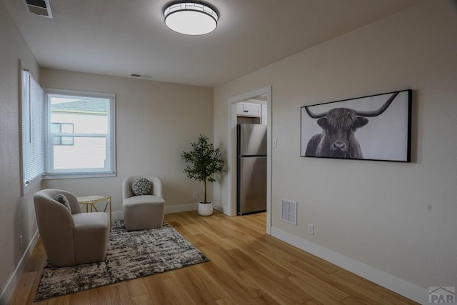 1709 Henry Ave, Pueblo, CO 81005 - living area with light wood finished floors and baseboards