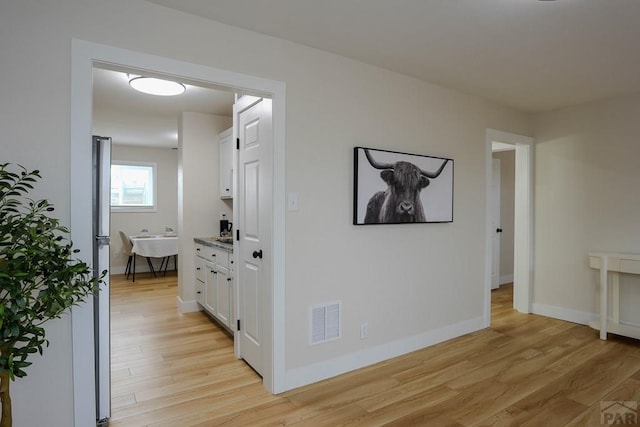 1709 Henry Ave, Pueblo, CO 81005 - hallway with light wood-type flooring and baseboards