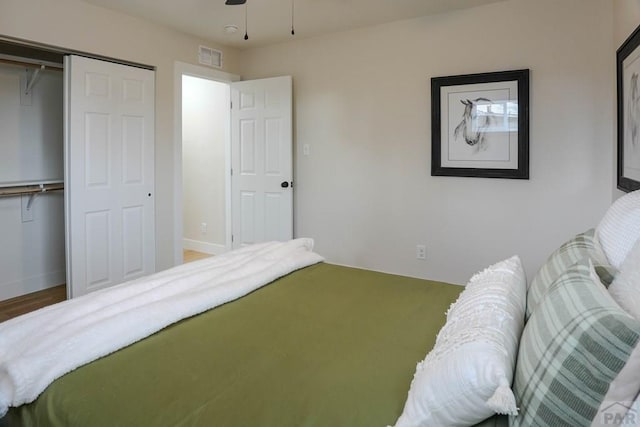 1709 Henry Ave, Pueblo, CO 81005 - bedroom with a closet, baseboards, and wood finished floors