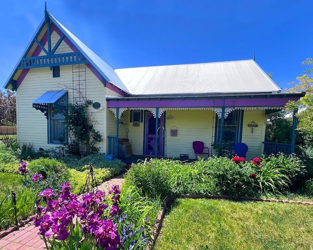 134 E Virginia St, La Veta, CO 81055 - victorian house featuring a porch and a metal roof