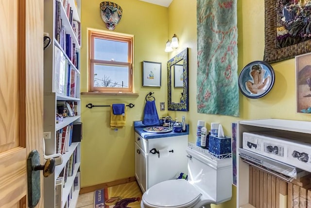 134 E Virginia Ave, La Veta, CO 81055 - bathroom with vanity, baseboards, and toilet