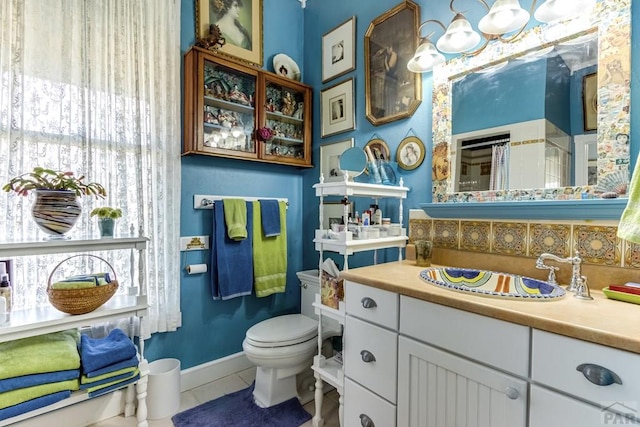 134 E Virginia St, La Veta, CO 81055 - full bath featuring plenty of natural light, vanity, a shower with shower curtain, and tile patterned floors
