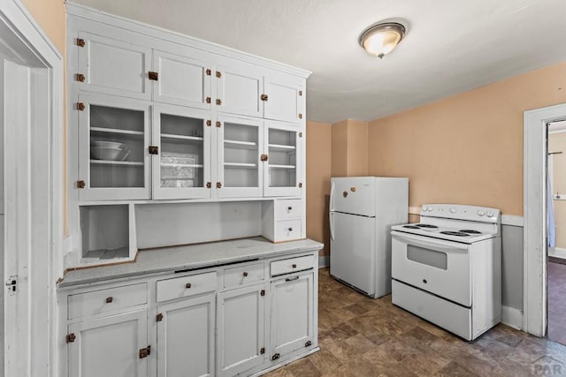 832 Berkley Ave Unit 834, Pueblo, CO 81004 - kitchen with white appliances, white cabinets, and glass insert cabinets