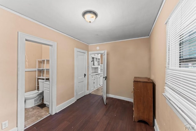 832 Berkley Ave Unit 834, Pueblo, CO 81004 - unfurnished bedroom featuring dark wood-style floors and crown molding