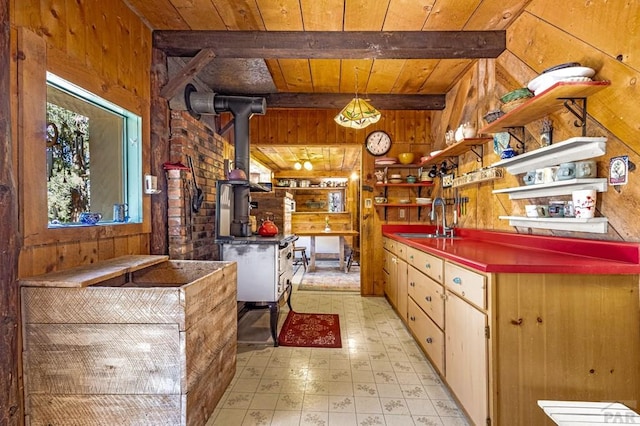 8929 Apache Dr, Beulah, CO 81023 - kitchen featuring wooden walls, a sink, wooden ceiling, light flooring, and open shelves